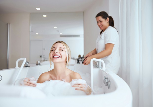 Freestanding stone bath with ridge view